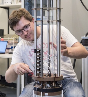 MSc. Andreas Wendl of TUM preparing a superconducting magnet system