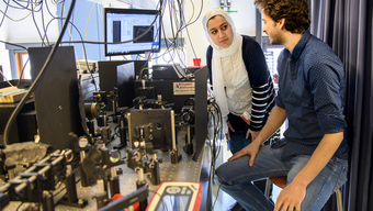 The first authors Elham Fadaly (left) and Alain Dijkstra (right) at the experimental setup for measurements of the emitted light.